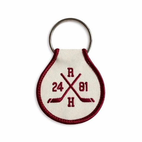 Unexpected Flair Embroidered Keychain: Heated Rivalry — Hockey Sticks cover image