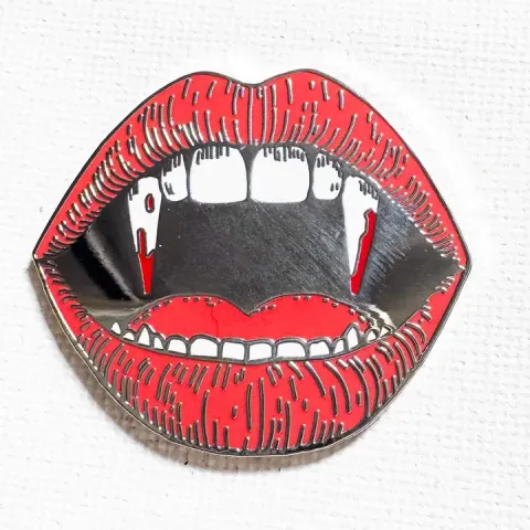 Strike Gently Enamel Pin: Vampire Teeth cover image