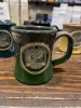Goblin Market Coffee Mug - Forest Green w/Sand White cover image