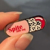 Cunning Linguist Enamel Pin: Spite Pill cover image