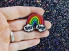 The Third Arrow Enamel Pronoun Pin: Rainbow & Clouds — They/Them cover image